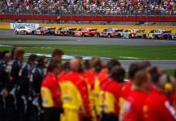 CONCORD, NC - MAY 25:  Crew members stand on the pit road during a red flag for the national moment of silence during the NASCAR Sprint Cup Series Coca-Cola 600 on May 25, 2009 at Lowe's Motor Speedway in Concord, North Carolina.  (Photo by Jason Smith/Ge