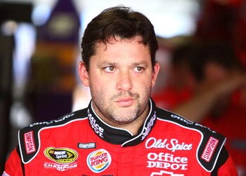CONCORD, NC - MAY 23:  Tony Stewart, driver of the #14 Office Depot/Old Spice Chevorlet, walks out of the garage area during practice for the NASCAR Sprint Cup Series Coca-Cola 600 on May 23, 2009 at Lowe's Motor Speedway in Concord, North Carolina.  (Pho