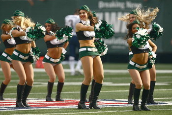 EAST RUTHERFORD, NJ - SEPTEMBER 14: Cheerleaders of the New York Jets perform at midfield during a break in NFL game action against the New England Patriots on September 14, 2008 at the Meadowlands, East Rutherford, New Jersey. The Patriots defeated the