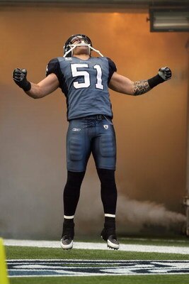SEATTLE - DECEMBER 07:  Lofa Tatupu #51 of the Seattle Seahawks celebrates as he enters the field before the game against the New England Patriots on December 7, 2008 at Qwest Field in Seattle, Washington. The Patriots defeated the Seahawks 24-21. (Photo 