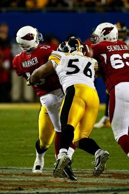 TAMPA, FL - FEBRUARY 01:  Quarterback Kurt Warner #13 of the Arizona Cardinals fumbles the ball with :15 seconds to play as he is sacked by LaMarr Woodley #56 of the Pittsburgh Steelers during Super Bowl XLIII on February 1, 2009 at Raymond James Stadium 