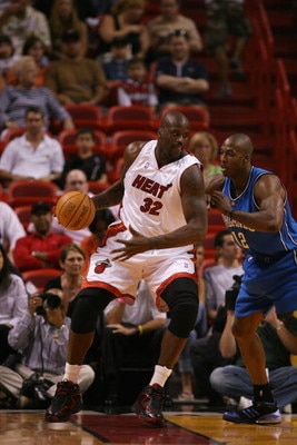 MIAMI - MARCH 18:  Shaquille O'Neal #32 of the Miami Heat goes up against Dwight Howard #12 of the Orlando Magic during the game at American Airlines Arena on March 18, 2007 in Miami, Florida.  The Magic won 97-83.  NOTE TO USER: User expressly acknowledg