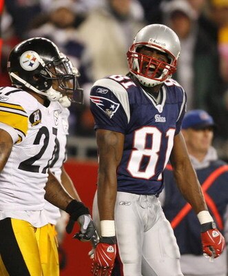 FOXBORO, MA - DECEMBER 09:   Randy Moss #81 of the New England Patriots reacts as he walks by Anthony Smith #27 of the Pittsburgh Steelers after a penalty was called in the third quarter on December 9, 2007 at Gillette Stadium in Foxboro, Massachusetts. T