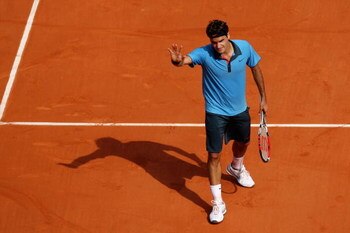 PARIS - MAY 25:  Roger Federer of Switzerland waves during his Men's Singles First Round match against Alberto Martin of Spain at the French Open on May 25, 2009 in Paris, France.  (Photo by Ryan Pierse/Getty Images)
