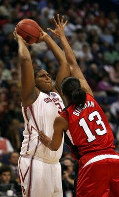 ST. LOUIS - APRIL 05:  Courtney Paris #3 of the Oklahoma Sooners looks to pass as Candyce Bingham #13 of the Louisville Cardinals defends during the Women's Final Four Semifinals on April 5, 2009 at the Scottrade Center in St. Louis, Missouri.  (Photo by 