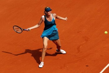 PARIS - MAY 25:  Maria Sharapova of Russia hits a forehand during the Women's First Round match against Anastasiya Yakimova of Belarus at the French Open at Roland Garros on May 25, 2009 in Paris, France.  (Photo by Ryan Pierse/Getty Images)