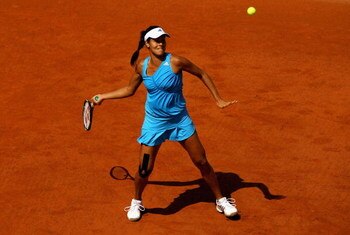 PARIS - MAY 24:  Ana Ivanovic of Serbia hits a forehand during her Ladies' Singles First Round match against Sara Errani of Italy at the French Open on May 24, 2009 in Paris, France.  (Photo by Clive Brunskill/Getty Images)