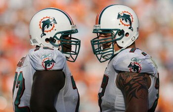 MIAMI - NOVEMBER 09:  Offensive linemen Vernon Carey #72 and Jake Long #77 of the Miami Dolphins talk between plays while taking on the Seattle Seahawks at Dolphin Stadium on November 9, 2008 in Miami, Florida. The Dolphins defeated the Seahawks 21-19.  (