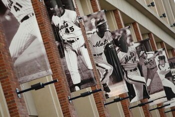 NEW YORK - APRIL 13: Banners of former New York Mets players hang on the outside of Citi Field before opening day on April 13, 2009 in the Flushing neighborhood of the Queens borough of New York City. This is the first regular season MLB game being played