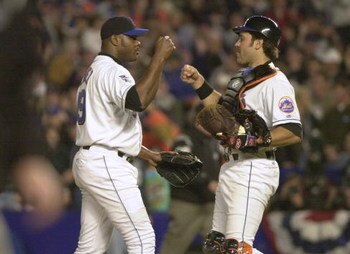 24 Oct 2000:  Catcher #31 Mike Piazza and #49Armando Benitez of the New York Mets celebrate the final out against the New York Yankees during Game 3 of the MLB World Series at Shea Stadium in Flushing, New York. <DIGITAL IMAGE> Mandatory Credit: Ezra Shaw