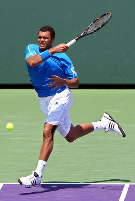 KEY BISCAYNE, FL - MARCH 31:  Jo-Wilfried Tsonga of France returns a shot against Gilles Simon of France during day nine of the Sony Ericsson Open at the Crandon Park Tennis Center on March 31, 2009 in Key Biscayne, Florida.  (Photo by Clive Brunskill/Get