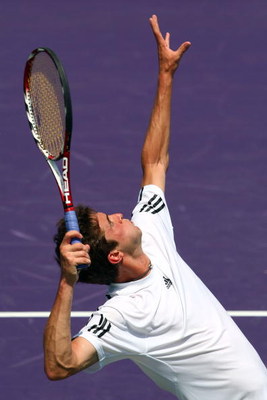 KEY BISCAYNE, FL - MARCH 31:  Gilles Simon of France serves against Jo-Wilfried Tsonga of France during day nine of the Sony Ericsson Open at the Crandon Park Tennis Center on March 31, 2009 in Key Biscayne, Florida.  (Photo by Clive Brunskill/Getty Image