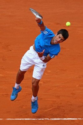 PARIS - MAY 26:  Novak Djokovic of Serbia serves during his Men's Singles First Round match against Nicolas Lapentti of Ecuador on day three of the French Open at Roland Garros on May 26, 2009 in Paris, France.  (Photo by Clive Brunskill/Getty Images)