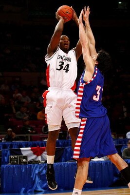 NEW YORK - MARCH 10:  Matija Poscic #31 of the DePaul Blue Demons defends the shot of Yancy Gates #34 of the Cincinnati Bearcats during the first round of the Big East Tournament at Madison Square Garden on March 10, 2009 in New York City.  (Photo by Chri