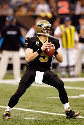 NEW ORLEANS - DECEMBER 28:  Quarterback Drew Brees #9 of the New Orleans Saints drops back to pass during the game against the Carolina Panthers on December 28, 2008 at the Superdome in New Orleans, Louisiana.  (Photo by Chris Graythen/Getty Images)