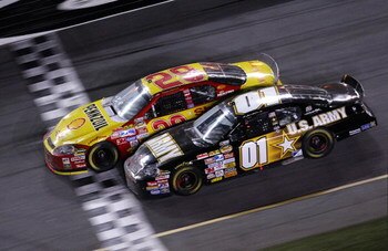 DAYTONA, FL - FEBRUARY 18:  Kevin Harvick, driver of the #29 Shell/Pennzoil Chevrolet, leads Mark Martin, driver of the #01 U.S. ARMY Chevrolet, to the finish line to win the NASCAR Nextel Cup Series Daytona 500 at Daytona International Speedway on Februa