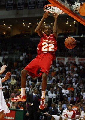 CORAL GABLES, FL - APRIL 01:  John Henson #22 of the West Team dunks against the East Team in the 2009 McDonald's All American Men's High School Basketball Game at BankUnited Center on April 1, 2009 in Coral Gables, Florida.  (Photo by Doug Benc/Getty Ima
