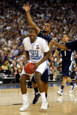 DETROIT - APRIL 04:  Ed Davis #32 of the North Carolina Tar Heels goes to shoot in front of Reggie Redding #15 of the Villanova Wildcats during the National Semifinal game of the NCAA Division I Men's Basketball Championship at Ford Field on April 4, 2009