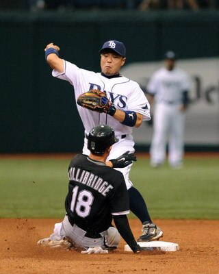 ST. PETERSBURG, FL - APRIL 19: Infielder Akinori Iwamura #1 of the Tampa Bay Rays throws to first base for a double play against the Chicago White Sox April 19, 2009 at Tropicana Field in St. Petersburg, Florida.  (Photo by Al Messerschmidt/Getty Images)