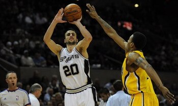 SAN ANTONIO - JANUARY 20:  Guard Manu Ginobili #20 of the San Antonio Spurs takes a shot against Brandon Rush #25 of the Indiana Pacers on January 20, 2009 at AT&T Center in San Antonio, Texas.  NOTE TO USER: User expressly acknowledges and agrees that, b