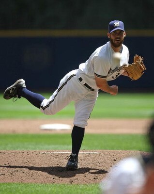 MILWAUKEE - MAY 14: Starting pitcher Dave Bush #31 of the Milwaukee Brewers delivers the ball against the Florida Marlins on May 14, 2009 at Miller Park in Milwaukee, Wisconsin. The Brewers defeated the Marlins 5-3. (Photo by Jonathan Daniel/Getty Images)