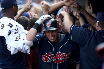 NEW YORK - APRIL 18: Asdrubal Cabrera #13 of the Cleveland Indians is congratulated in the dugout after hitting a second inning grand slam home run against the New York Yankees at Yankee Stadium on April 18, 2009 in the Bronx borough of New York City. (Ph