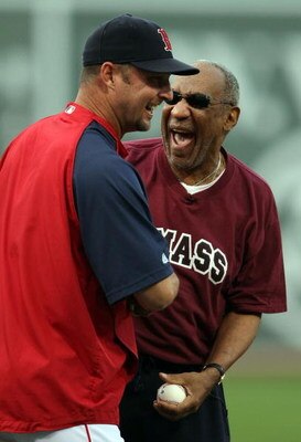 BOSTON - AUGUST 14:  Tim Wakefield #49 of the Boston Red Sox jokes with comedian Bill Cosby after Cosby threw out the first pitch before the game against the Texas Rangers on August 14, 2008 at Fenway Park in Boston, Massachusetts.  (Photo by Elsa/Getty I