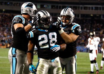 CHARLOTTE, NC - DECEMBER 08:  Jonathan Stewart  #28 of the Carolina Panthers celebrates with teammates after scoring a touchdown against the Tampa Bay Buccaneers at Bank of America Stadium on December 8, 2008 in Charlotte, North Carolina  (Photo by Street