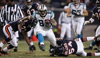 CHICAGO - JANUARY 15:  Steve Smith #89 of the Carolina Panthers breaks away form Brian Urlacher #54 and Jerry Azumah #23 of the Chicago Bears in the NFC Divisional playoff game at Soldier Field on January 15, 2006 in Chicago, Illinois. The Panthers defeat