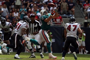 HOUSTON - OCTOBER 12:  Tight end Anthony Fasano #80 of the Miami Dolphins drops a pass against the Houston Texans at Reliant Stadium on October 12, 2008 in Houston, Texas.  (Photo by Ronald Martinez/Getty Images)