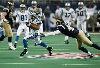 ST. LOUIS - JANUARY10:  Receiver Steve Smith #89 of the Carolina Panthers gets behind the St. Louis Rams defense to score the winning touchdown in overtime in the NFC Divisional Playoffs on January 10, 2004 at the Edward Jones Dome in St. Louis, Missouri.
