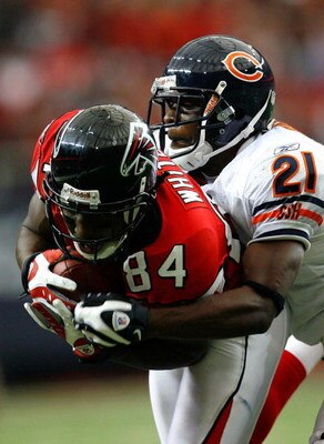 ATLANTA - OCTOBER 12:  Corey Graham #21 of the Chicago Bears tackles receiver Roddy White #84 of the Atlanta Falcons during the game at the Georgia Dome on October 12, 2008 in Atlanta, Georgia.  (Photo by Kevin C. Cox/Getty Images)