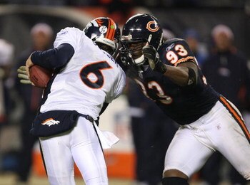 CHICAGO - NOVEMBER 25: Adewale Ogunleye #93 of the Chicago Bears sacks Jay Cutler #6 of the Denver Broncos late in regulation on November 25, 2007 at Soldier Field in Chicago, Illinois. (Photo by Jonathan Daniel/Getty Images)