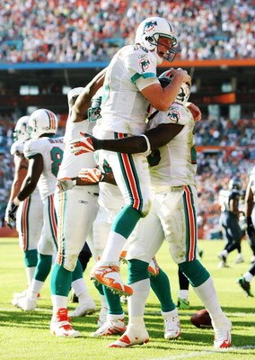 MIAMI - NOVEMBER 09:  Running back Ronnie Brown #23 and quarterback Chad Pennington #10 of the Miami Dolphins celebrate after Brown's touchdown run in the fourth quarter against the Seattle Seahawks at Dolphin Stadium on November 9, 2008 in Miami, Florida