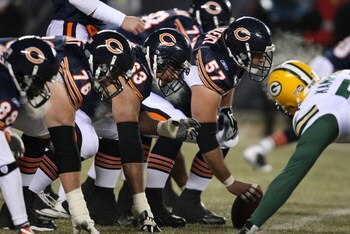 CHICAGO - DECEMBER 22: Members of the Chicago Bear offensive line including Olin Kreutz #57, Roberto Garza #63 and John Tait #76 line-up in front of the Green Bay Packer defense on December 22, 2008 at Soldier Field in Chicago, Illinois. The Bears defeate