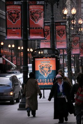 CHICAGO - FEBRUARY 02:  Pedestrians walk past Chicago Bears banners which line many of the streets in the Loop February 2, 2007 in Chicago, Illinois. The Bears will face the Indianapolis Colts in the Super Bowl on February 4.  (Photo by Scott Olson/Getty 