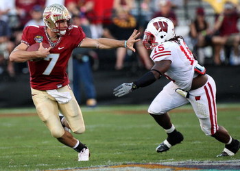 ORLANDO, FL - DECEMBER 27: Christian Ponder #7 of the Florida State Seminoles attempts to avoid the tackle of Culmer St. Jean #15 of the Wisconsin Badgers during the Champs Bowl on December 27, 2008 at the Citrus Bowl in Orlando, Florida. (Photo by Sam