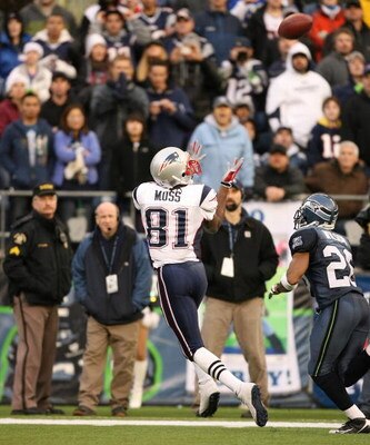 SEATTLE - DECEMBER 07:  Wide receiver Randy Moss #81 of the New England Patriots hauls in a 33 yard catch in the fourth quarter against Josh Wilson #26 of the Seattle Seahawks on December 7, 2008 at Qwest Field in Seattle, Washington. The Patriots defeate