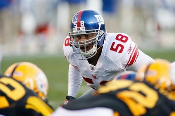 PITTSBURGH - OCTOBER 26:  Antono Pierce #58 of the New York Giants gets ready at the line of scrimmage during the game against the Pittsburgh Steelers at Heinz Field on October 26, 2008 in Pittsburgh, Pennsylvania. (Photo by: Rick Stewart/Getty Images)