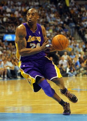 DENVER - MAY 23:  Kobe Bryant #24 of the Los Angeles Lakers moves the ball against the Denver Nuggets in Game Three of the Western Conference Finals during the 2009 NBA Playoffs at Pepsi Center on May 23, 2009 in Denver, Colorado. NOTE TO USER: User expre