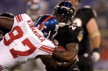 BALTIMORE, MD - AUGUST 19:  Willis McGahee #23 of the Baltimore Ravens is tackled by Mathias Kiwanuka #97 of the New York Giants during a preseason NFL game August 19, 2007 at M&T Bank Stadium in Baltimore, Maryland.  (Photo by Greg Fiume/Getty Images)
