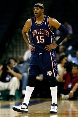 CHARLOTTE, NC - OCTOBER 15:  Vince Carter #15 of the New Jersey Nets stands on the court during the game against the Charlotte Bobcats at Charlotte Bobcats Arena on October 15, 2007 in Charlotte, North Carolina.  The Bobcats won 96-86.  NOTE TO USER: User