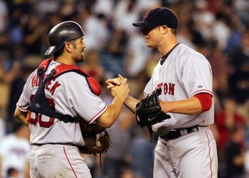 NEW YORK - JULY 03:  Jason Varitek #33 of the Boston Red Sox congratulates teammate Jon Lester #31 after Lester shutout the New York Yankees 7-0 on July 3, 2008 at Yankee Stadium in the Bronx borough of New York City.  (Photo by Jim McIsaac/Getty Images)