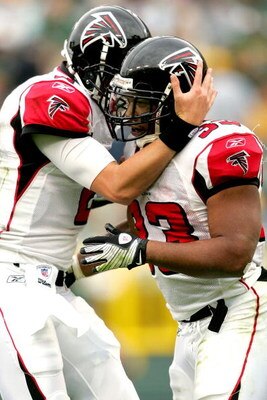 GREEN BAY, WI - OCTOBER 05:  Quarterback Matt Ryan #2 of the Atlanta Falcons celebrates a touchdown late in the fourth quarter with Michael Turner #33 against the Green Bay Packers at Lambeu Field October 5, 2008 in Green Bay, Wisconsin.  (Photo by Matthe