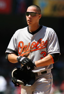ANAHEIM, CA - AUGUST 06: Lou Montanez #3 of the Baltimore Orioles walks to the dugout during the game against the Los Angeles Angels of Anaheim at Angel Stadium on August 6, 2008 in Anaheim, California. The Angels defeated the Orioles 9-4. (Photo by Ch