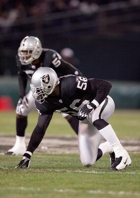OAKLAND, CA - DECEMBER 23: Derrick Burgess #56 of the Oakland Raiders gets ready to move at the snap during the game against the Kansas City Chiefs at McAfee Coliseum on December 23, 2006 in Oakland, California. (Photo by Jed Jacobsohn/Getty Images)
