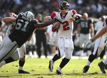 OAKLAND, CA - NOVEMBER 02:  Matt Ryan #2 of the Atlanta Falcons fumbles the ball as Gerard Warren #61 of the Oakland Raiders defends during an NFL game on November 2, 2008 at the Oakland-Alameda County Coliseum in Oakland, California.  (Photo by Jed Jacob