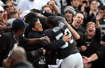 OAKLAND, CA - NOVEMBER 2:  Linebacker Kirk Morrison #52 of the Oakland Raiders interacts with the fans during the game against the Atlanta Falcons on November 2, 2008 at the Oakland-Alameda County Coliseum in Oakland, California. The Falcons defeated the 