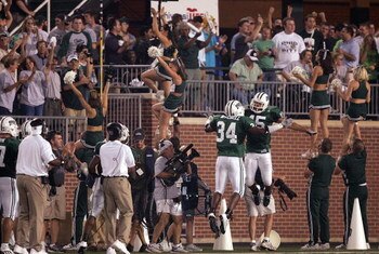ATHENS, OH - SEPTEMBER 9:  Cornerback Dion Byrum #15 of the Ohio Bobcats celebrates his interception for a touchdown with defensive back Michael Mitchell #34 to tie the score at 7-7 against the Pittsburgh Panthers during the first quarter at Peden Stadium