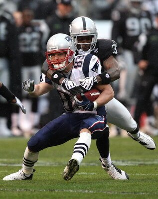 OAKLAND, CA - DECEMBER 14: Wes Welker #83 of the New England Patriots catches a pass as Chris Johnson #37 of the Oakland Raiders defends during an NFL game on December 14, 2008 at the Oakland-Alameda County Coliseum in Oakland, California.  (Photo by Jed 